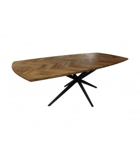 Stół na metalowych czarnych nogach do salonu urządzonego w stylu industrialnym .