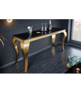 Piękna konsola z czarnym blatem na złotych nogach do salonu urządzonego w stylu glamour.