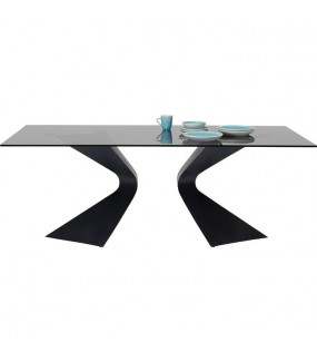 Oryginalny stół z metalową czarną podstawą oraz szklanym blatem do wnętrz glamour.