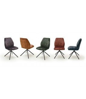 Krzesło tapicerowane w optyce weluru świetnie sprawdzi się w salonie w stylu industrialnym.
